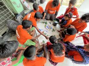 Children engaged in social artwork