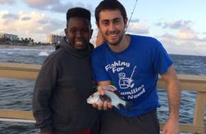 Program Director (Ethan Rossler) with student