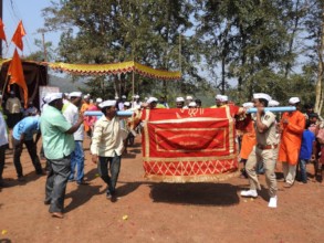 Traditional worship dance with Pangolin replica