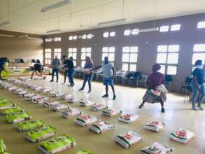 Working together to lay out food items.