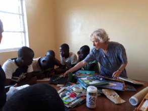 Marguerite teaching the children dominoes