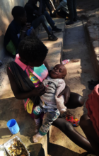 Mum and baby supported by Kimbilio outreach team