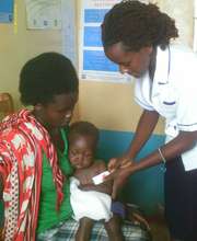 Nurse Theresia caring for Mirriam