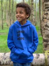 David Jr. in a Land of Hope sweatshirt