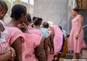 Inmates waiting for food distribution