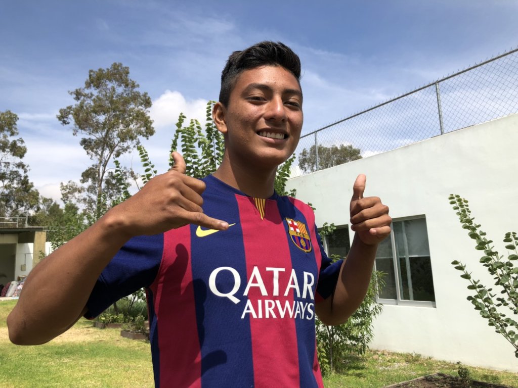 Eliud wearing his Barcelona shirt