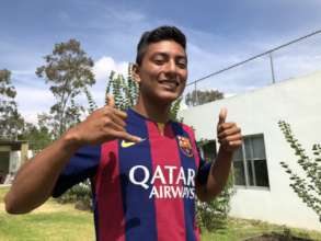 Eliud wearing his Barcelona shirt