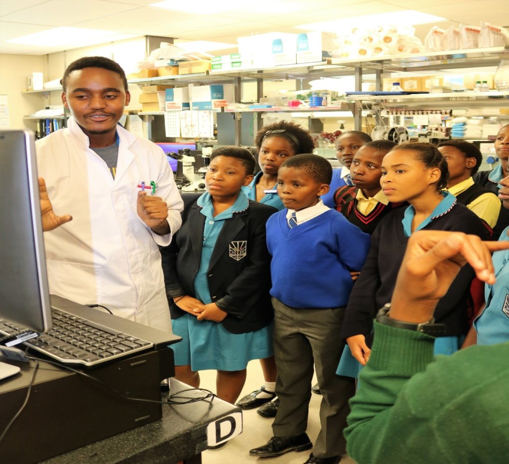 PhD Student explaining his research to Y-SiP team