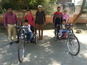 Tricycles were given to students