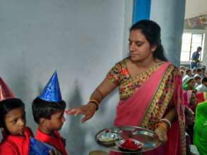 Teacher welcome students in traditional way