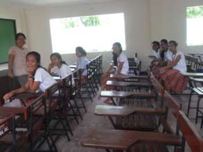 students sitting on school chairs