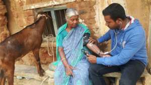 Checking Narasamma's progress during a home visit