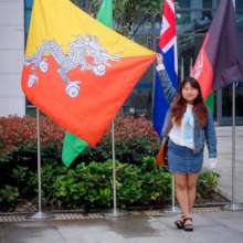 AUW Student Tshering with the Bhutan Flag