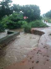 Wild water flows damage feeder road to Makoba