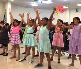 Students perform at a Compton School Board mtg