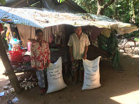 A Happy Family Receives Rice