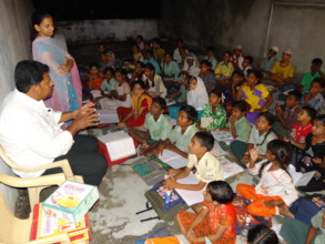 Chairman with children at educational centre