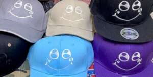Jasmine's smile design embroidered on caps