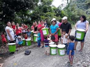 Families Proudly Carrying Their Water Filters Home