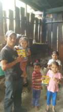 Jose Genaro with four children in his home