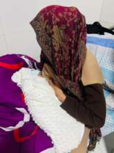 a mother breastfeeding her baby after birth