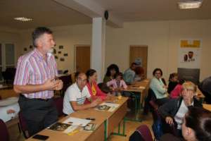 Parents attend a lecture with psychologist