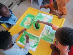 Children drawing how they see a leopard
