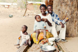 The Phiri family enjoying their sweet potatoes