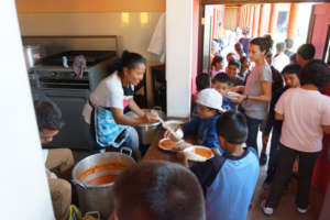 The school cooks handing out nutritious meals.