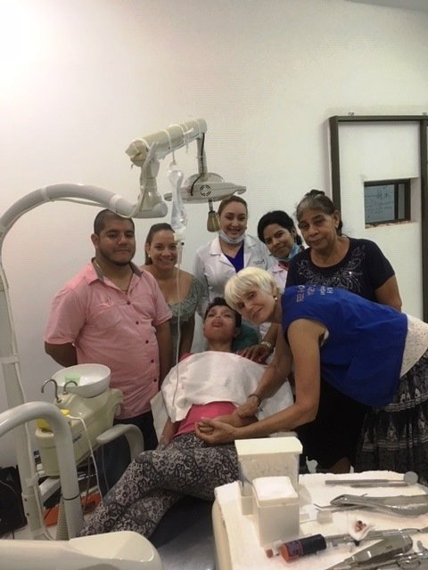 loyda with the dentist team