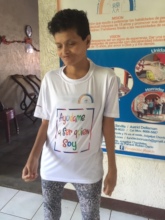 Loyda, in  shirt, with  logo and key message