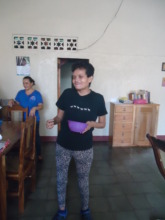 Loyda bringing her plate to the kitchen