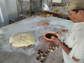 Watching the making of old-time-recipe bread.