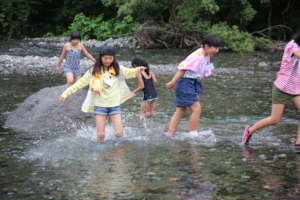 Enjoying splashing in shallow river