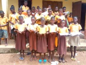 Bolni pupils showing reading and writing materials