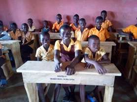 Gmayayemi (Middle) & friends enjoying their desks