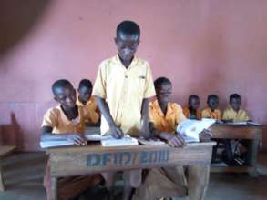 Kwesi leading reading session in class
