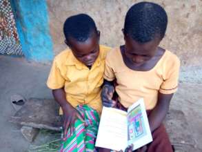 Maabadan & Gmayaye reading at home