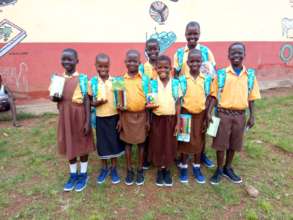 Manan (tallest) and friends with donated items