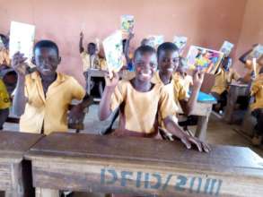Nidan and classmates smilling with their readers
