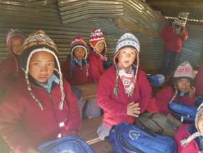 with their jacket,hat and bag in classroom