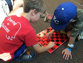 Teaching a camper to play checkers