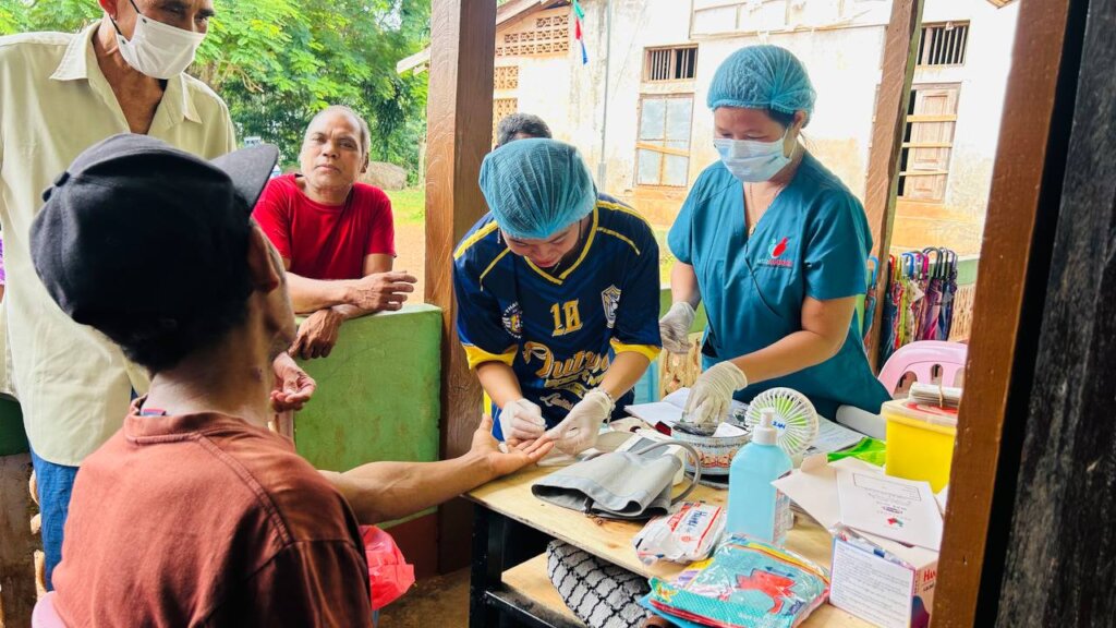 mobile clinic visit with nurse and CHV