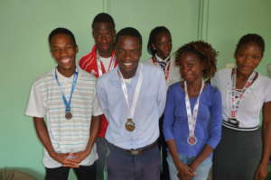 Support Group Showing Off Running Trophies