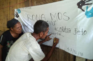 Women and men standing together against GBV