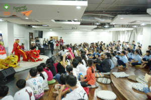 Lion dance performance by children at a shelter