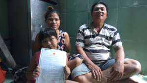 K.N received birth certificate with her parents