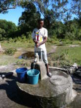 A young man using a fully functional well