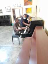 Akena playing in session with teacher