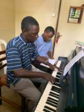 Athanius in a piano lesson